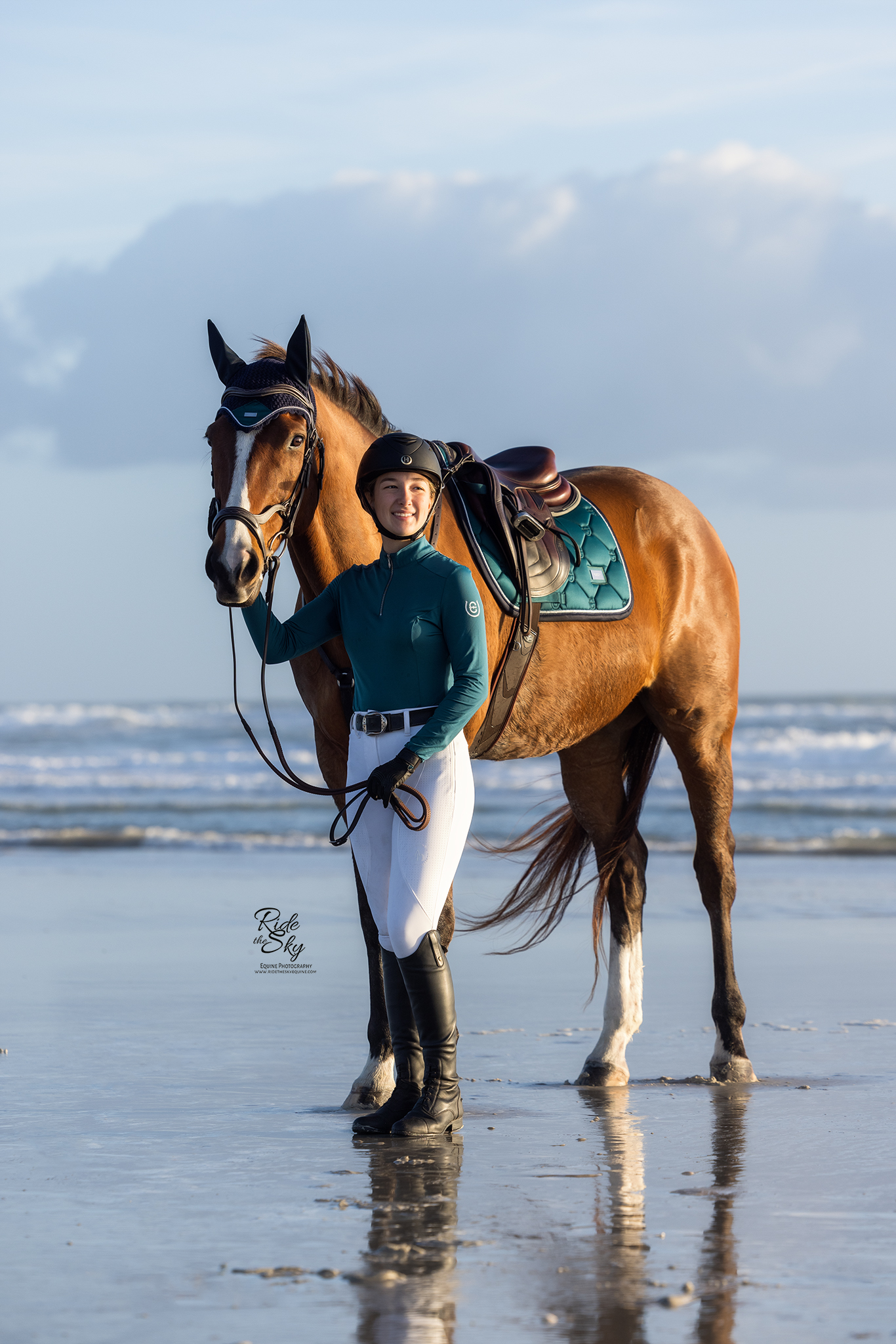 girl on beach with thoroughbred horse