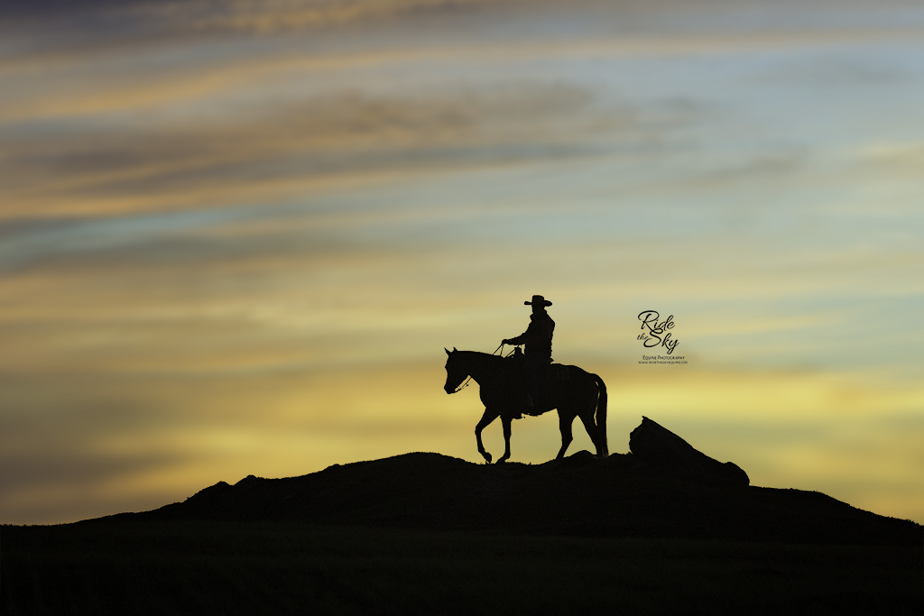 Cowboy and Horse on Ridge in Silhouette