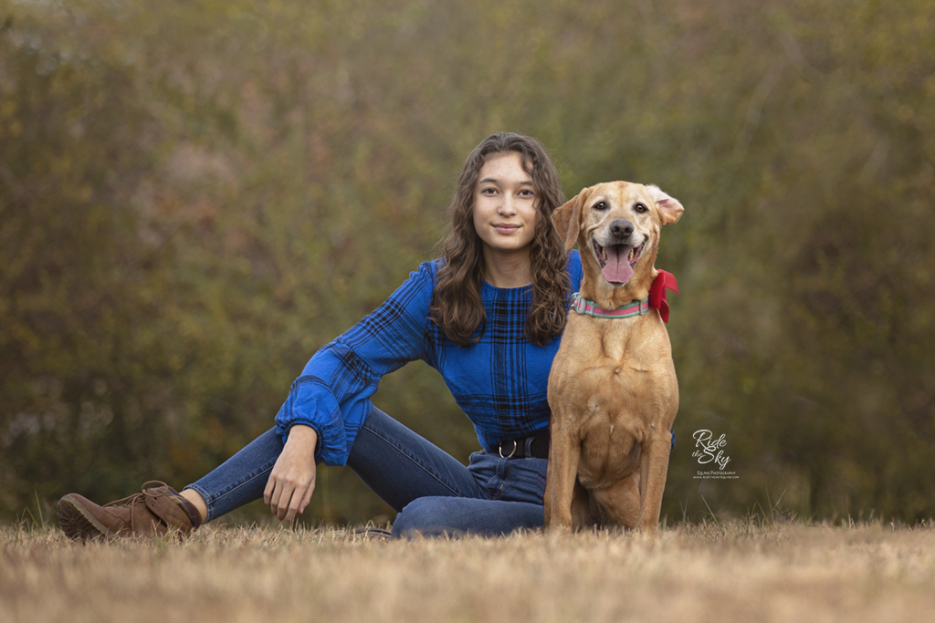 Teenage Girl with sassy Black Mouth Cur Dog in fall