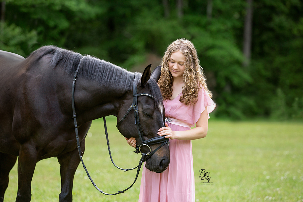 Girl and Thoroughbred horse in emotional moment