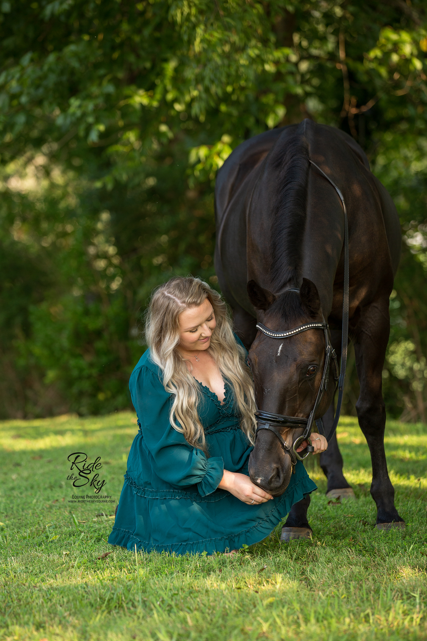 women in green dress and quarter horse during a portrait session