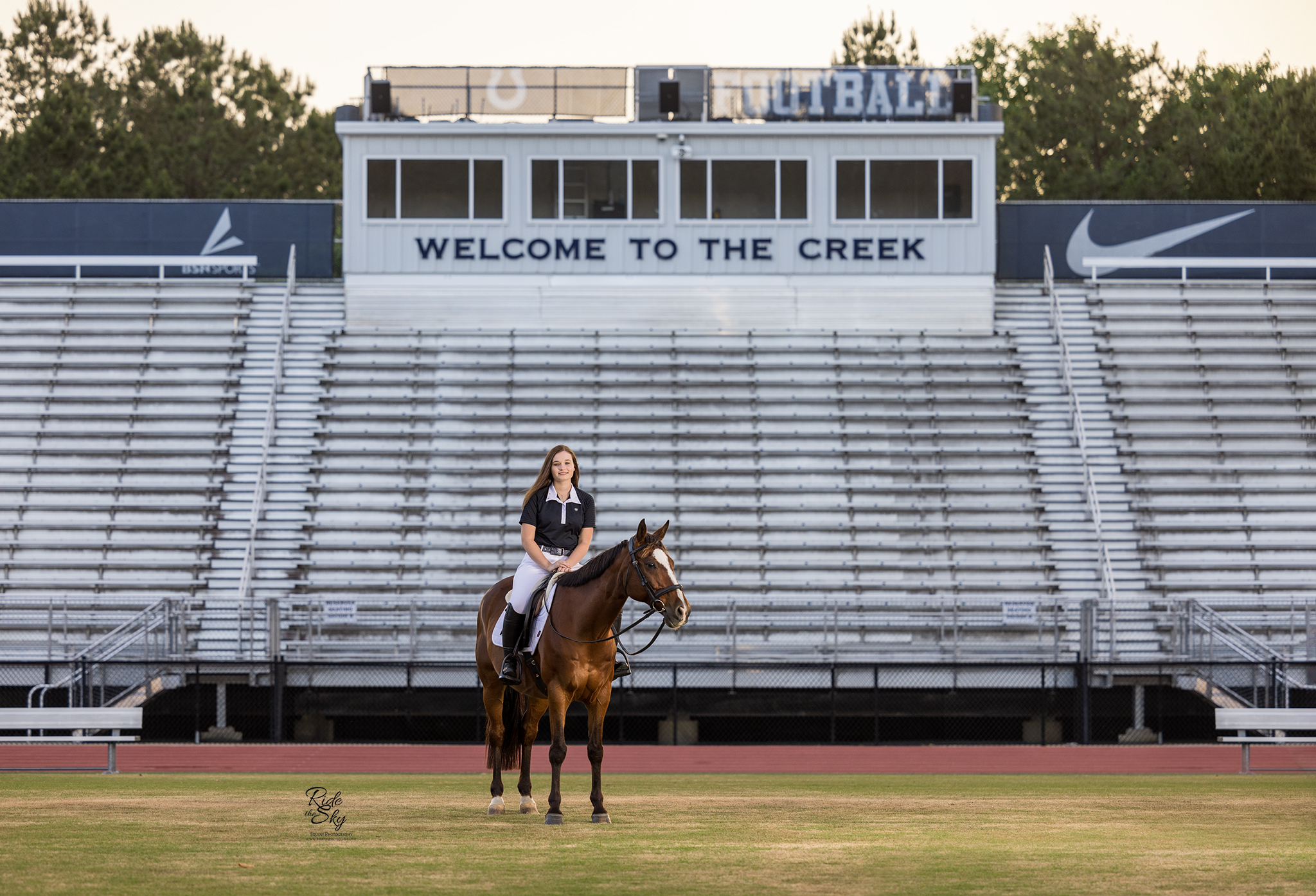 High School Senior on Football Field with her Horse for Senior Pictures