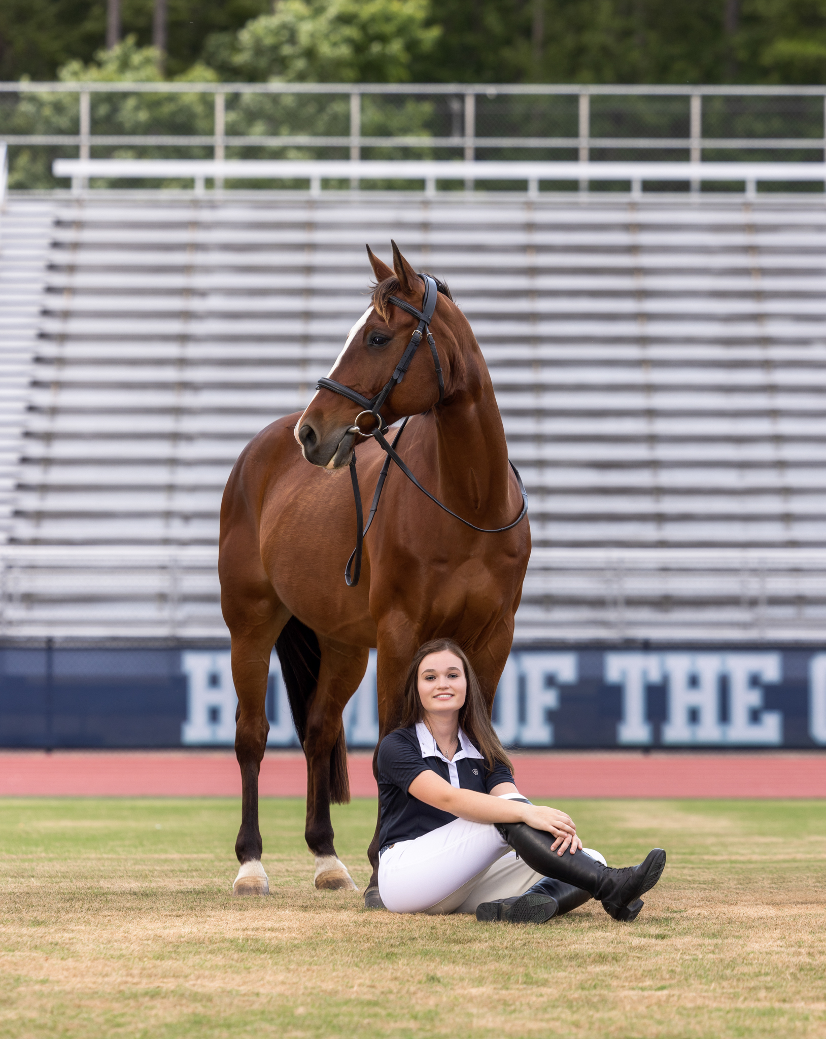 High School Senior Pictures with Horse on school football field